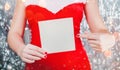 Female hands holding Merry Christmas card or letter to Santa. Xmas and New Year theme. Royalty Free Stock Photo