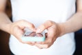 Female hands holding a mobile phone. Smartphone with a technological concept. The girl types a text message on her mobile phone an