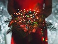 Female hands holding Multicolored Christmas light decorations on Royalty Free Stock Photo