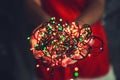 Female hands holding Multicolored Christmas light decorations on Royalty Free Stock Photo