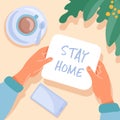 Female hands holding note with Stay home message. Table top view with potted plant, cup of coffee and mobile phone. Flat cartoon