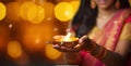 Female hands holding oil lamp celebrating Diwali, beautiful lights bokeh background. Generative AI