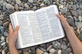 Female hands holding open Bible Royalty Free Stock Photo