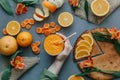 Female hands holding orange smoothie decorated with alstroemeria with orange pie Royalty Free Stock Photo