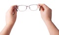 Female hands holding a pair of glasses Royalty Free Stock Photo