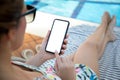 Female hands holding phone with isolated screen background of pool Royalty Free Stock Photo