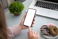 Female hands holding phone with isolated screen in the office Royalty Free Stock Photo