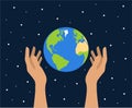 Female hands holding planet Earth on a blue starry space background. Earth day concept Royalty Free Stock Photo