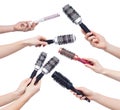 Female hands holding round hairbrush isolated on white background Royalty Free Stock Photo