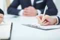 Female hands holding a silver pen closeup. Business job offer, financial success, certified public accountant concept.