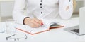 Female hands holding a silver pen closeup. Royalty Free Stock Photo