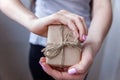 Female hands holding small gift box Royalty Free Stock Photo