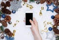 Female hands holding smart mobile phone on white background with Royalty Free Stock Photo