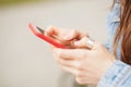 Female hands holding a smartphone