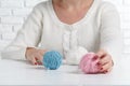 Female hands holding stitching, yarn, thread close up. materials for handmade and handiwork Royalty Free Stock Photo