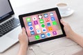 Female hands holding tablet with home screen icons apps Royalty Free Stock Photo