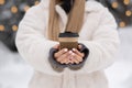 Female hands holding tea cup at the street Royalty Free Stock Photo