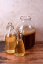 Tea mushroom in glass jars on wooden background. Preparing kombucha.