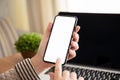 Female hands holding touch phone with isolated screen in office Royalty Free Stock Photo