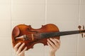 Hands Holding Violin in Air - Beautiful Vintage Looking Musical Instrument