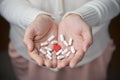 Female hands is holding pills. Royalty Free Stock Photo