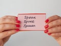 Female hands holds flashcards with handwritten irregular English verbs. Language learning concept Royalty Free Stock Photo