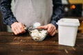 Female hands holds spoon with margarine over bowl Royalty Free Stock Photo