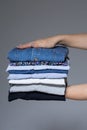 Female hands with ironed clothes
