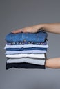 Female hands with ironed clothes Royalty Free Stock Photo