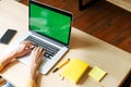 Female hands on the keyboard of a laptop indoor