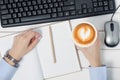 Female hands keyboard mouse from computer notebook pen cup of coffee Royalty Free Stock Photo