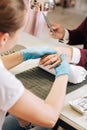 Female hands kneading male hands