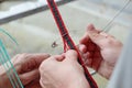 Female hands knitting the belt