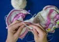 Female hands knitting with spokes