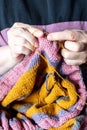 female hands knitting sweater from yarn closeup Royalty Free Stock Photo