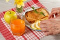 Female hands lay down breakfast food on a plate. Toast with Royalty Free Stock Photo