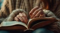 Female hands leafing through book