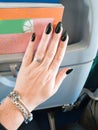 Female hands with long nails with green nail polish Royalty Free Stock Photo