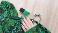 Female hands with long nails with green nail polish Royalty Free Stock Photo