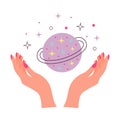 Female hands and magic planet with stars.