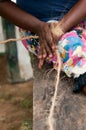 Female hands make a corn from coconut copra fibre