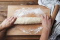 Female Hands Making Dough for baking pie, or pizza. Homemade Preparing Food. Top view. Rustic background. Royalty Free Stock Photo