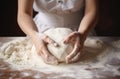 Female hands making dough. Hands kneading bread dough on a cutting board Royalty Free Stock Photo