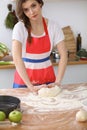 Female hands making dough for pizza or bread on wooden table. Baking concept Royalty Free Stock Photo