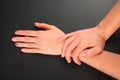 Female hands manicure on a black background. studio isolate. Royalty Free Stock Photo