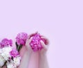 Female hands manicure flower peony glamour on a colored background Royalty Free Stock Photo