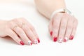 Female hands with manicure, red nail polish, drawing with cherries. White background. Royalty Free Stock Photo