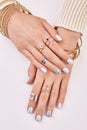 Female hands with manicure on a white background. Royalty Free Stock Photo