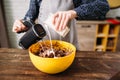 Female hands mixing cake ingredients