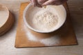 Female hands mixing dough in the home kitchen
